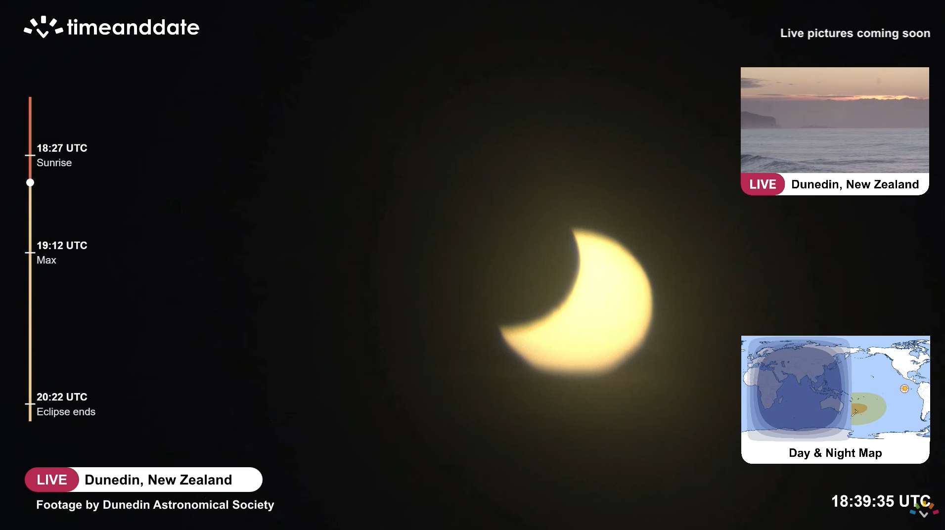 A picture of the sun's disk during a partial eclipse, with its upper left portion obscured by the silhouette of Earth's moon during a livestream.
