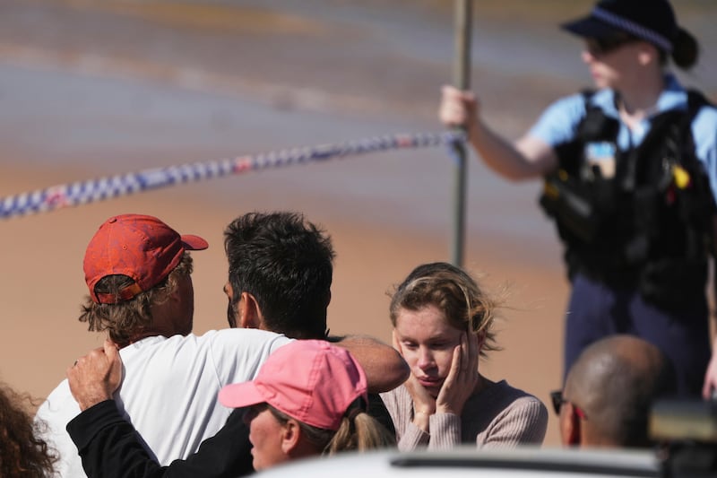 Police and members of the public at the scene near Dee Why, Sydney. Photograph: AP