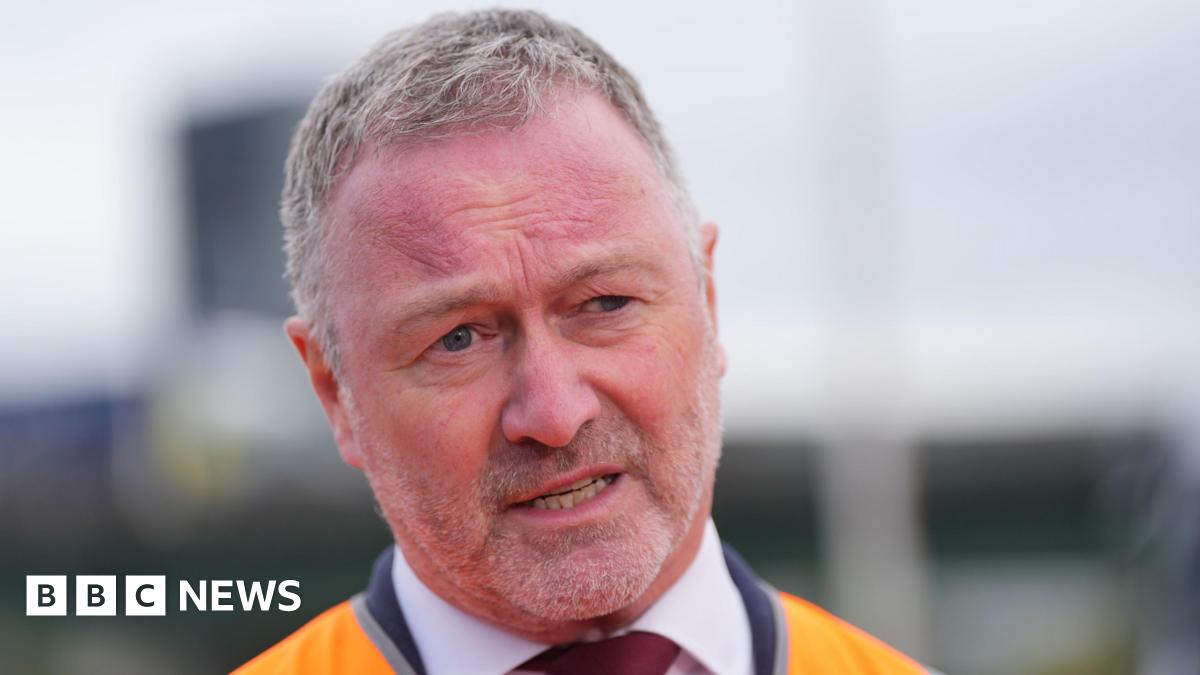 Steve Reed doing an interview, wearing an orange high-vis jacket