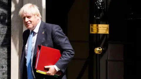 Getty Images Boris Johnson leaves No 10 Downing Street in July 2022.