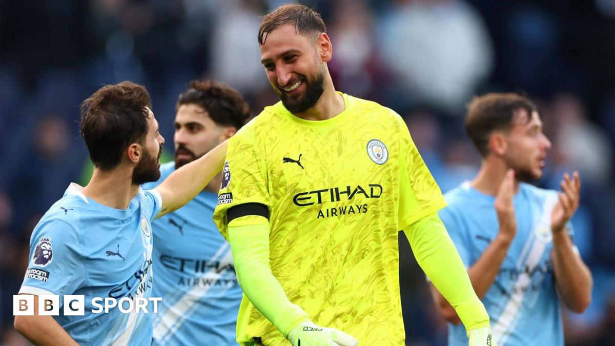 Gianluigi Donnarumma celebrates with his Manchester City team-mates after the win over Manchester United