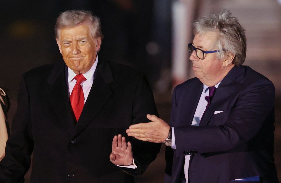 U.S. President Donald Trump is greeted by Viscount Henry Hood, representing Britain's King Charles, as he arrives for his state visit to Britain, at London Stansted Airport near London, Britain, September 16, 2025. REUTERS/Chris Radburn