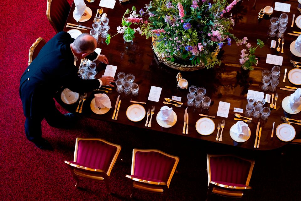 File photo dated 16/09/25 of adjustments being made to table decorations for a State Banquet at Windsor Castle, Berkshire. Donald Trump will be wined and dined at a sumptuous white tie state banquet in Windsor Castle on Wednesday evening. Aaron Chown/PA Wire