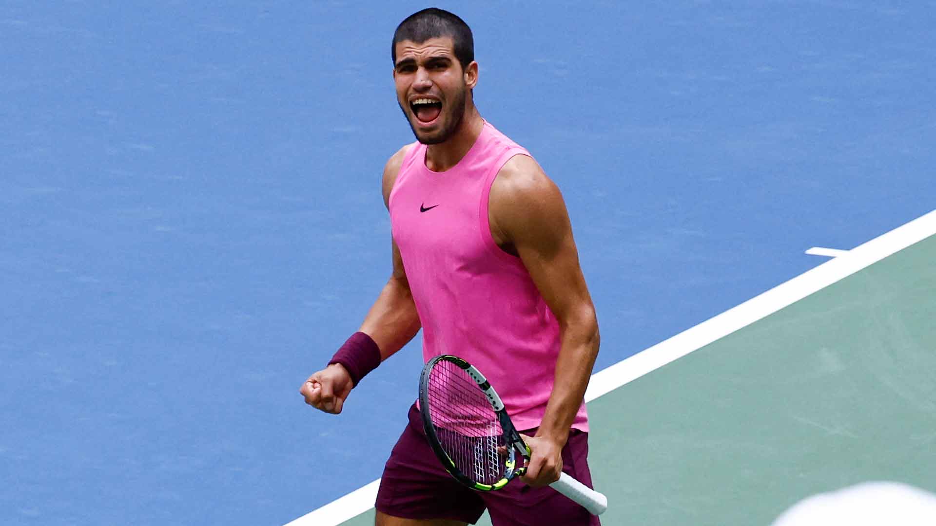 Carlos Alcaraz celebrates during a straight-sets win against Novak Djokovic Friday in New York.