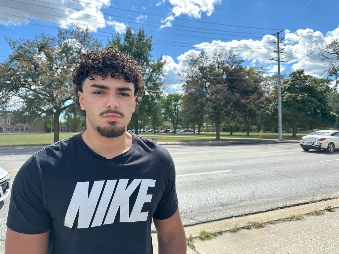 A man in a nike black tee.
