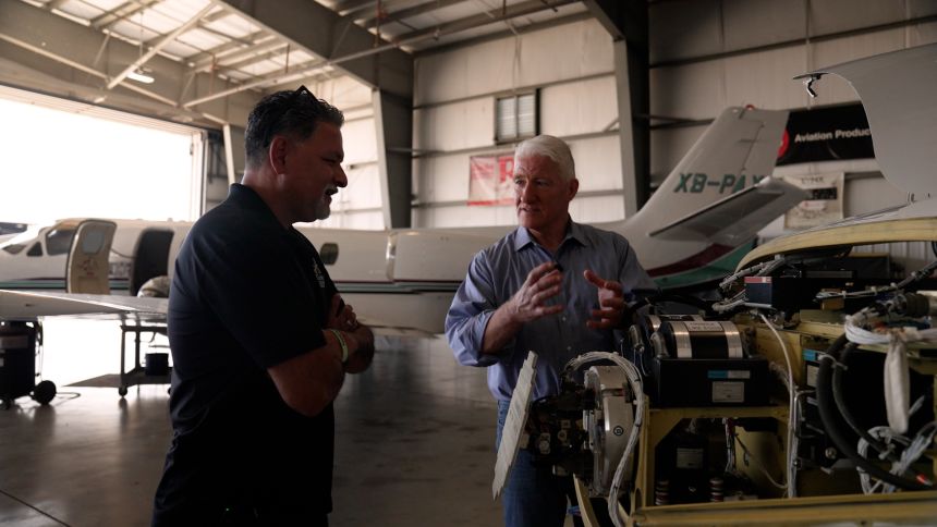Manny Rizo and John King speak at Rizo's company RizoJet Avionics, an aircraft maintenance company in Pflugerville, Texas