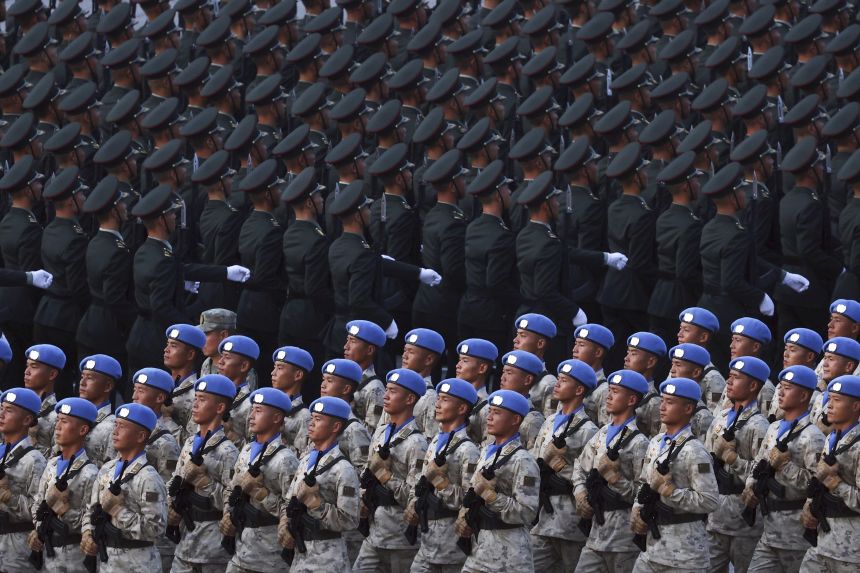 Military personnel take part in a military parade to commemorate the 80th anniversary of the end of World War II held in front of Tiananmen Gate in Beijing, China, Wednesday, Sept. 3, 2025.