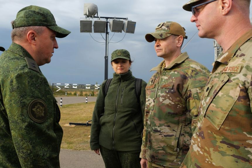 Belarusian Defense Minister Viktor Khrenin, left, speaks with Lt. Col. Bryan Shoupe, second right, Defense Attache at the US Embassy in Minsk, after joint Russian-Belarusian military drills at a training ground near Barysaw, Belarus, on Monday.