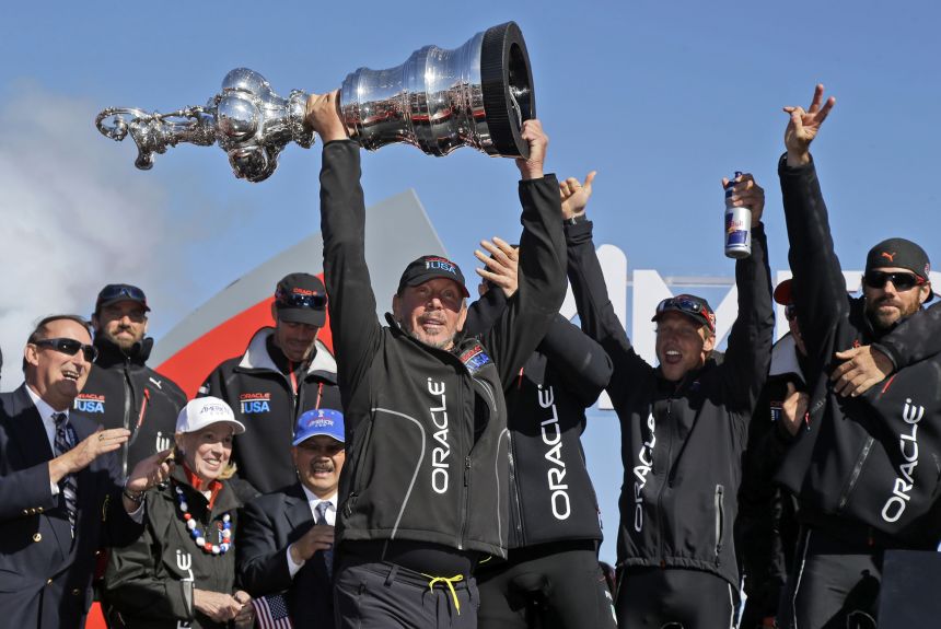 Oracle CEO Larry Ellison and crew celebrate after Oracle Team USA won the America's Cup sailing event in 2013.