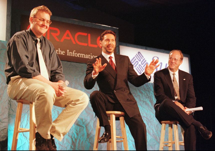 Larry Ellison, founder of Oracle, sits between Marc Andreesen, left, and Jan-Pieter Scheerder, in a 1996 photo.
