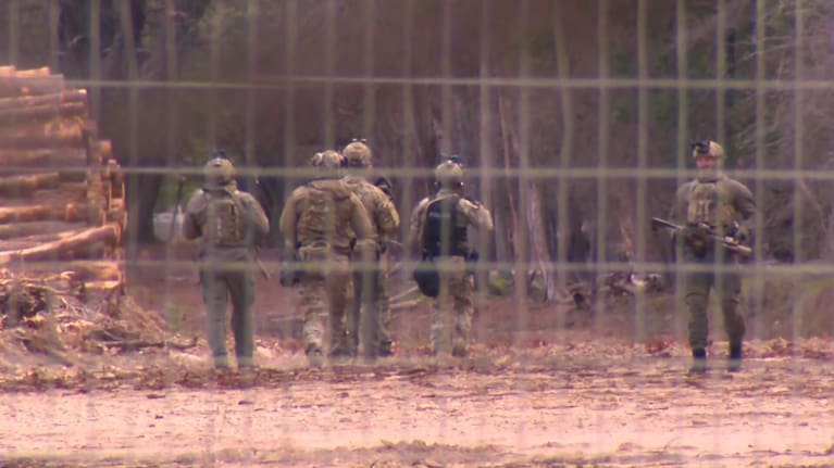 Armed police in Porepunkah as the hunt for accused police killer Dezi Freeman continued. 