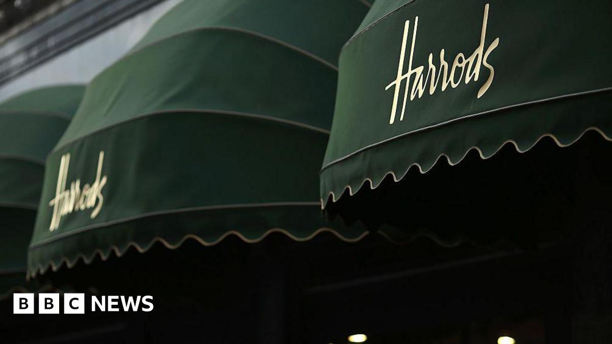 Green awnings with Harrods written on them outside the famous department store