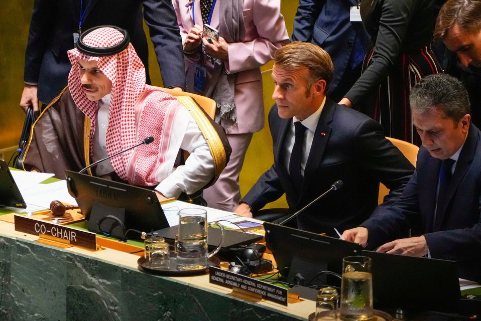 Saudi Arabia Prime Minister Mohammed bin Salman Al Saud, left, and France President Emmanuel Macron, center, prepare to lead a high-profile meeting at the United Nations aimed at galvanizing support for a two-state solution to the Israeli-Palestinian conflict Monday, Sept. 22, 2025, at UN headquarters. (AP Photo/Yuki Iwamura)