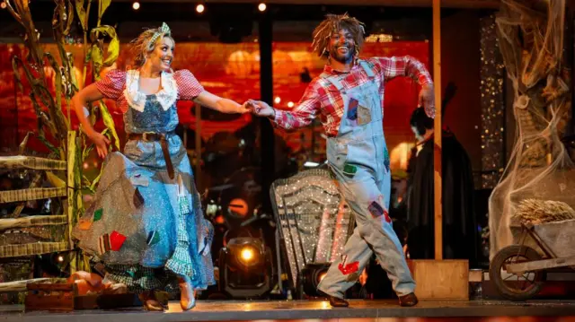 Amy and JB Gill dressed in Wizard of Oz themed outfits dancing