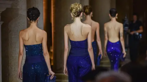 EPA Models present creations by late Italian designer Giorgio Armani of the Spring/Summer 2026 Women's Collection at the Milan Fashion Week, in Milan, Italy, 27 September 2025.