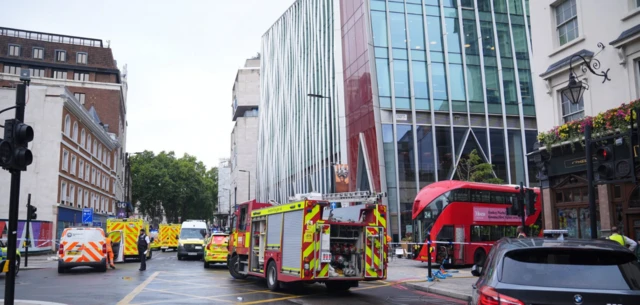 Emergency services at the scene on Allington Street, London, following an accident involving a double-decker bus. Fire engines, ambulances and police vehicles can be seen parked up outside the red double decker bus