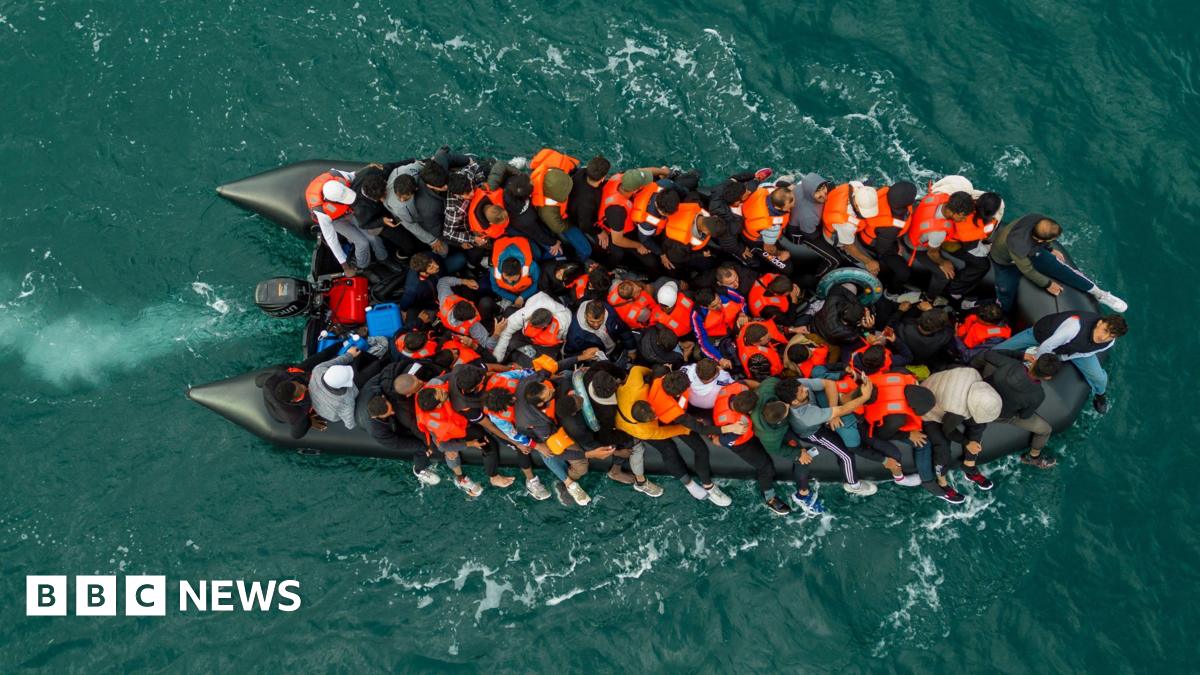 In this drone view an inflatable dinghy carrying migrants makes its way towards England in the English Channel