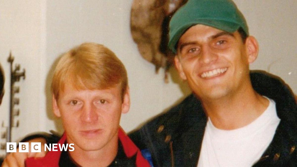 An old photograph of Matt Appleby in his 20s, wearing a green cap with his arm around then Forest player Stuart Pearce.