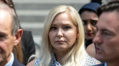 Getty Images Jeffrey Epstein victim Virginia Roberts Giuffre speaks at a press conference following a hearing where Jeffrey Epstein victims made statements, at Manhattan Federal Court 