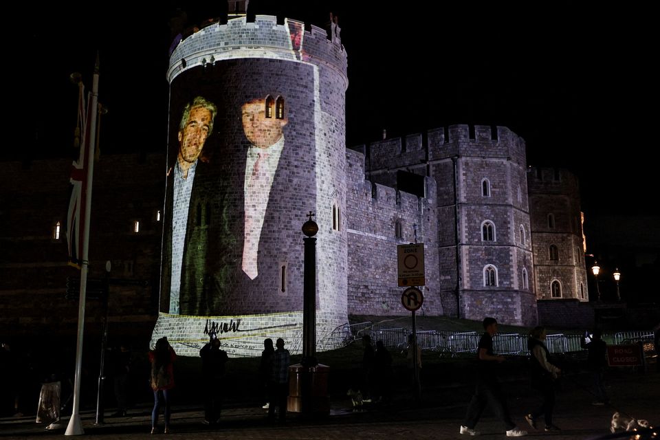 An image of U.S. President Donald Trump alongside disgraced financier Jeffrey Epstein is projected on Windsor castle, after U.S. President Donald Trump and first lady Melania Trump arrival for a state visit to the country, in Windsor, Berkshire, Britain September 16, 2025. REUTERS/Phil Noble