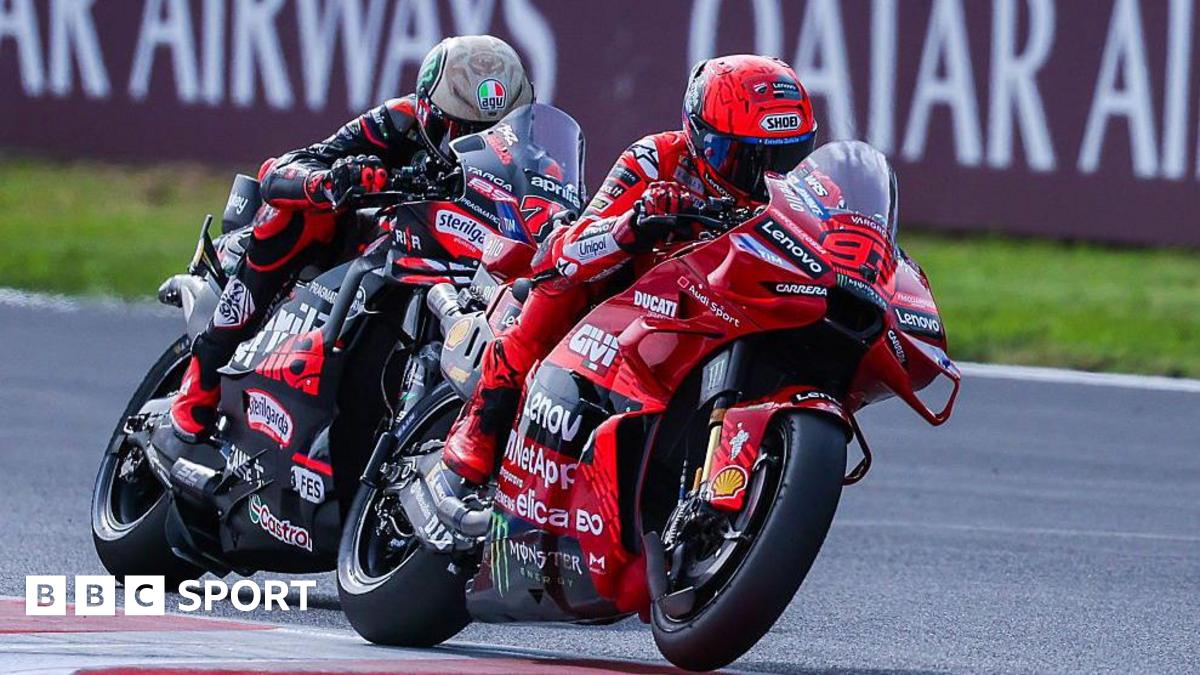 Marc Marquez overtaking Marco Bezzecchi during the San Marino Grand Prix.