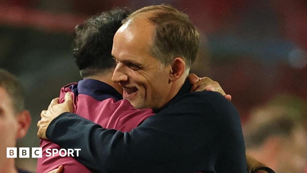 England head coach Thomas Tuchel is embraced by a member of his backroom team after the 5-0 win against Serbia in Belgrade