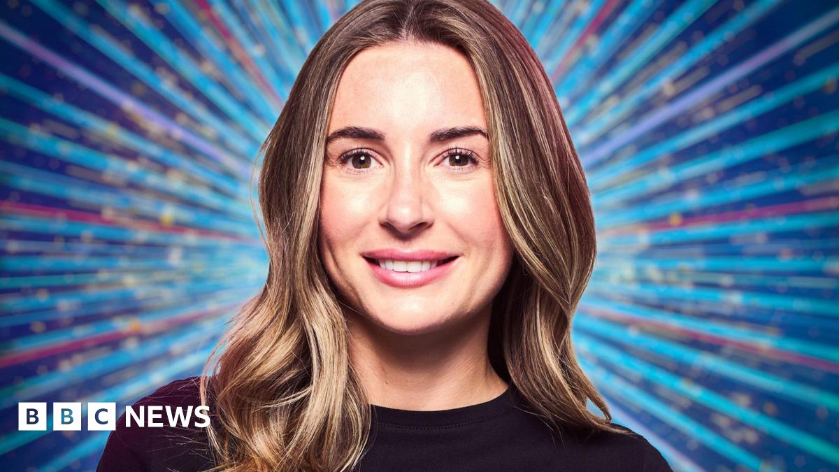 Dani Dyer with her long brown hair down