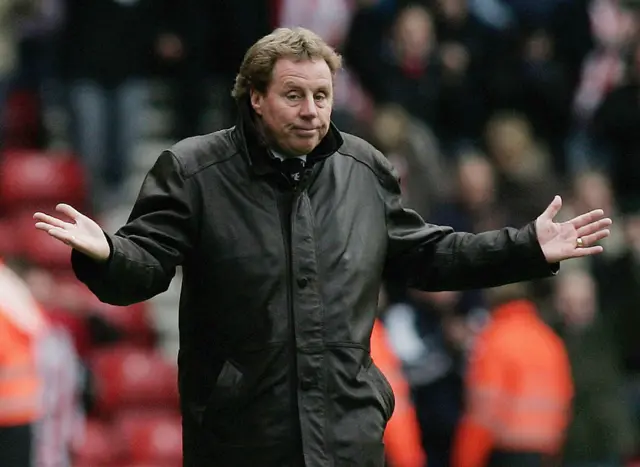 Harry Resknapp shrugs his shoulders with arms outstretched on the touchline