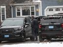 Duxbury Police work at the scene where two children were found dead and an infant injured, Wednesday, Jan. 25, 2023, in Duxbury, Mass.