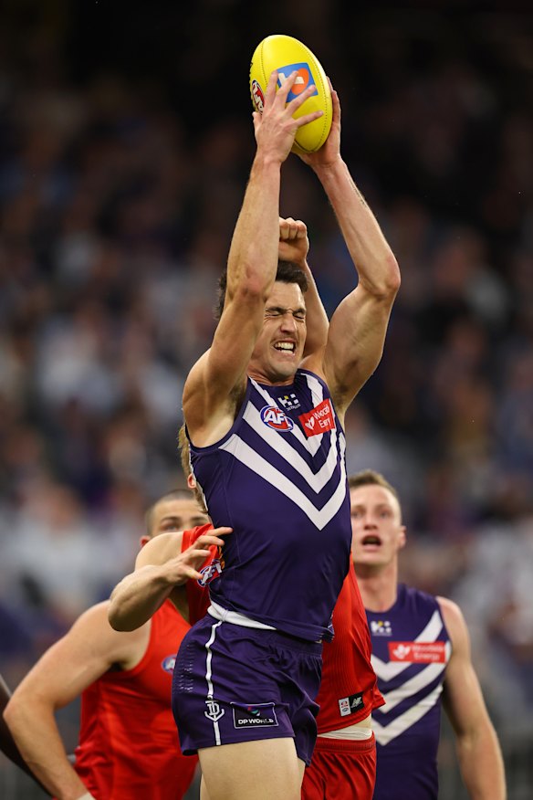 Patrick Voss of the Dockers contests for a mark.