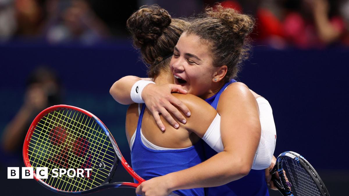 Jasmine Paolini and Sara Errani embrace after beating Ukraine in decisive Billie Jean King Cup doubles match