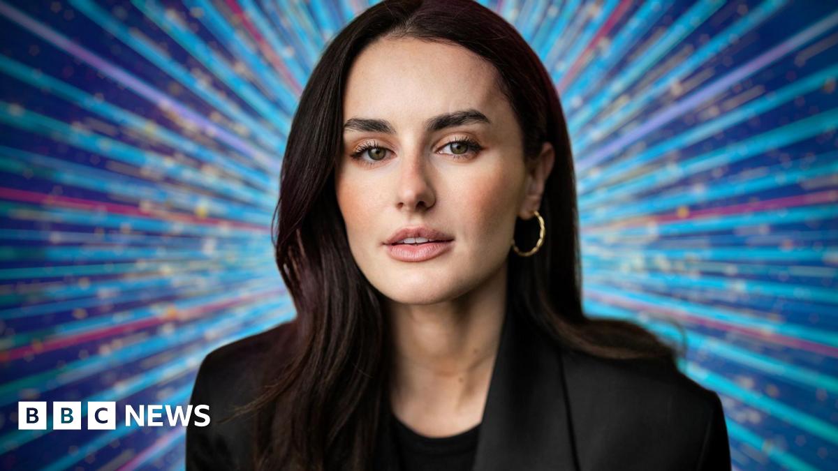 Amber Davies in a black suit