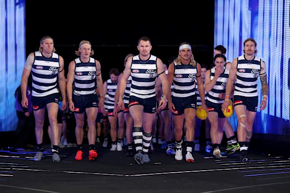Patrick Dangerfield of the Cats leads his team out.