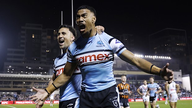Ronaldo Mulitalo celebrates a try with his Sharks teammates during the NRL elimination final against the Roosters.