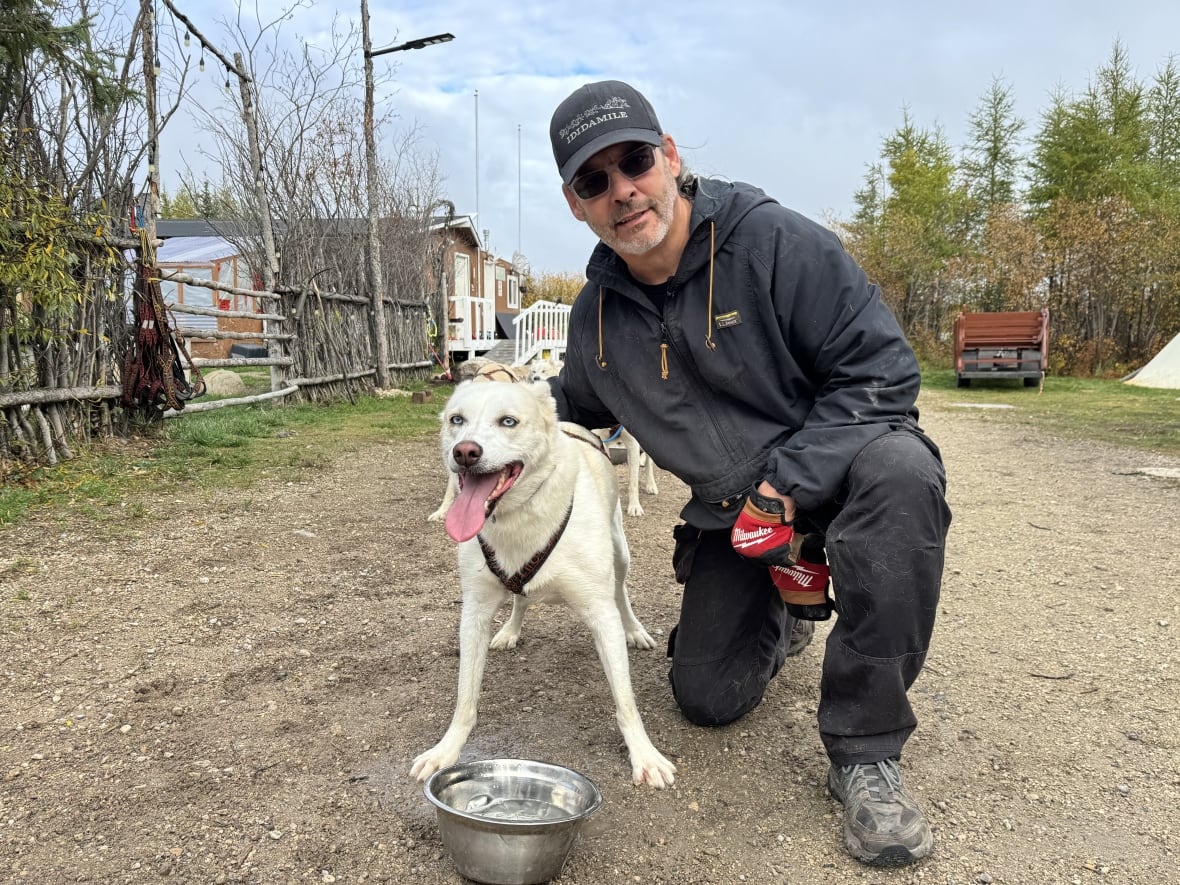 David Daley, owner of Wapusk Adventures, and his lead sled dog, Rea. Daley has lived in Churchill, Man., his whole life and has seen the community re-invent itself many times.