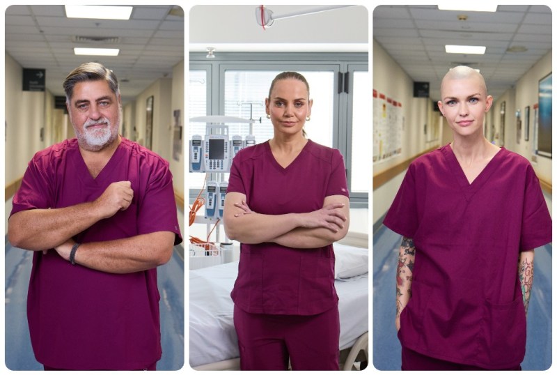 Three healthcare professionals wearing maroon scrubs stand confidently in a hospital setting. The image showcases a male nurse on the left, a female nurse in the centre, and a female nurse with tattoos on the right. Each individual displays a strong and professional demeanor, highlighting the dedication of medical staff in patient care.