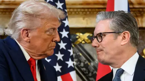 Getty Images Donald Trump and Sir Keir Starmer stare at each other against the backdrop of US and British flags at Chequers press conference