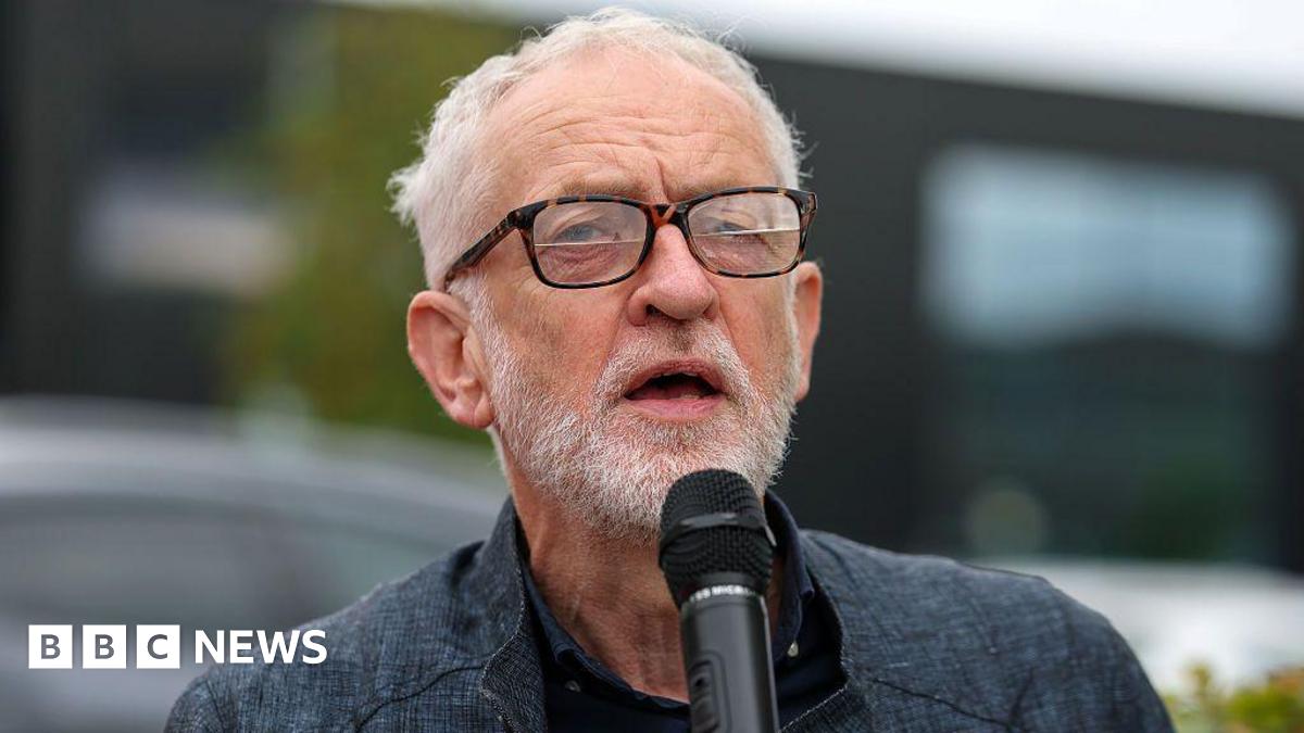 Jeremy Corbyn speaks into a microphone.