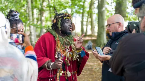 PA Media Kofi Offeh speaks to the media at the campsite in woods near Jedburgh.