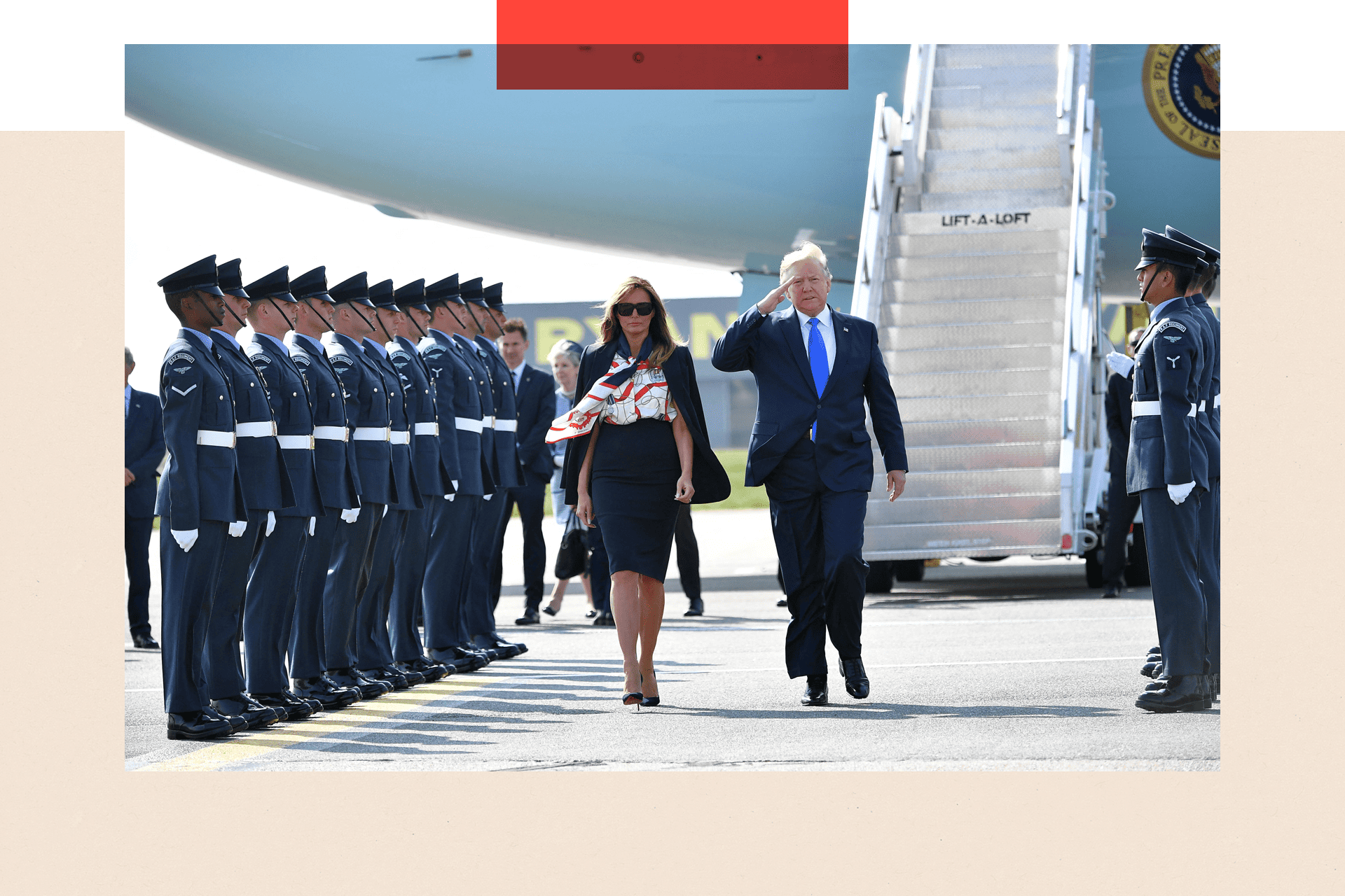 US President Donald Trump (R) and US First Lady Melania Trump (L) walk on the tarmac after disembarking Air Force One 
