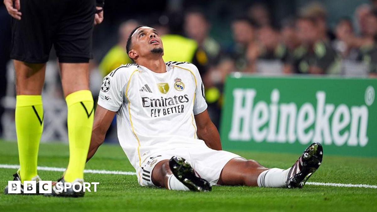 Trent Alexander-Arnold sits on the floor and looks up to the sky