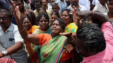 Reuters Relatives of the victims mourn in front of Karur Government Medical College hospital, following a stampede incident at an election campaign rally held by Tamilaga Vettri Kazhagam party, in Karur district of Tamil Nadu, India, September 28, 2025.