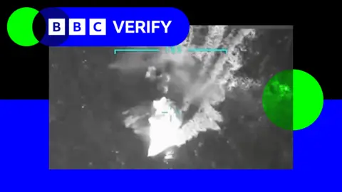 Donald Trump/Truth Social An image taken from footage shared of the strike by Donald Trump. A boat can be seen moving in the ocean from what appears to be a drone camera. 