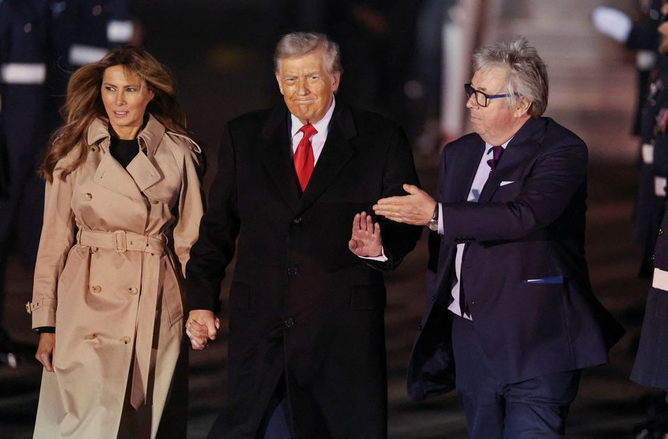 U.S. President Donald Trump and first lady Melania Trump are greeted by Viscount Henry Hood, representing Britain's King Charles, as they arrive for their state visit to Britain, at London Stansted Airport near London, Britain, September 16, 2025. REUTERS/Chris Radburn