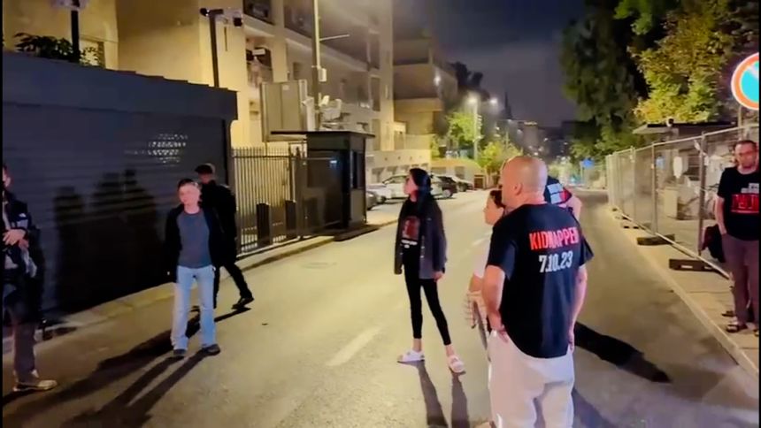 In an image taken from video shared by the Hostages and Missing Families Forum, Einav Zangauker, center, the mother of Israeli hostage Matan Zangauker, stands outside Netanyahu’s house with other hostage families, yelling in anguish.