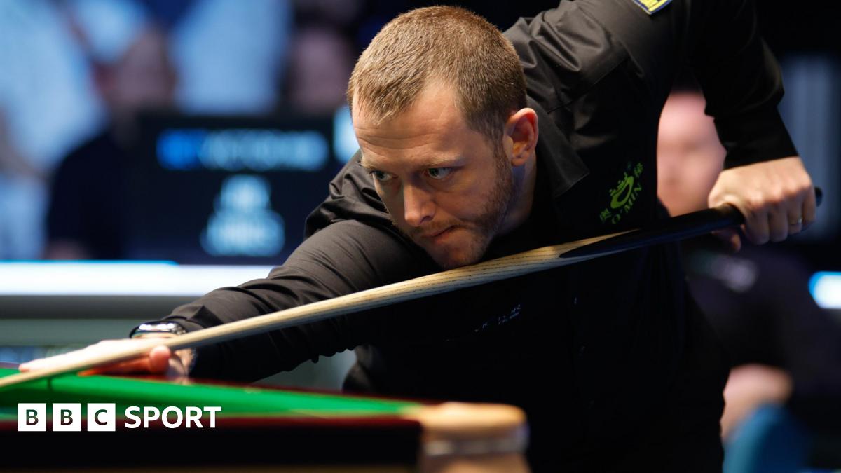 Mark Allen plays a shot