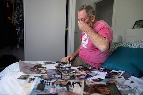 An emotional Ashley Gollan looks over family photos from happier times.
