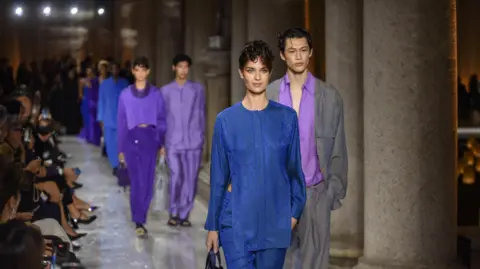 EPA Models present creations by late Italian designer Giorgio Armani of the Spring/Summer 2026 Women's Collection at the Milan Fashion Week, in Milan, Italy, 28 September 2025. 