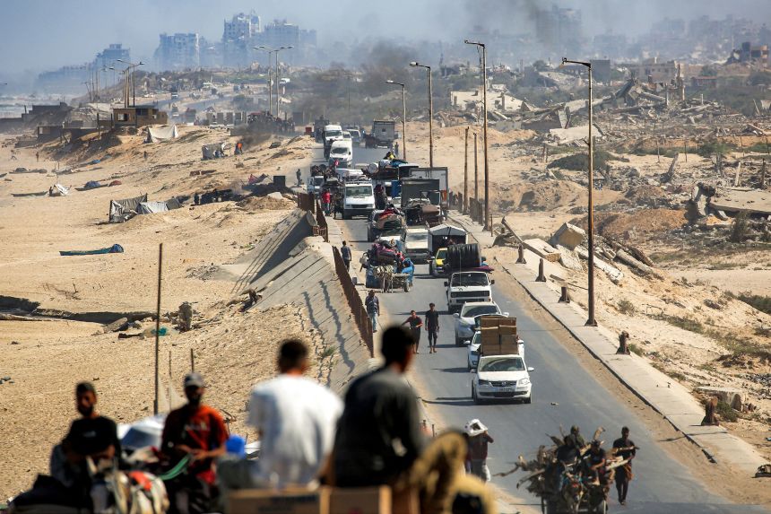 Vehicles move along the coastal road used by displaced people evacuating from Gaza City, in Nuseirat in the central Gaza Strip, on September 9.