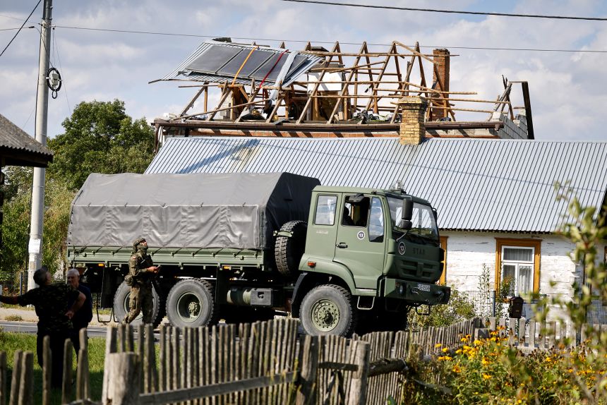 Police and army inspect damage to a house destroyed by debris from a Russian drone in the village of Wyryki, eastern Poland, on September 10.